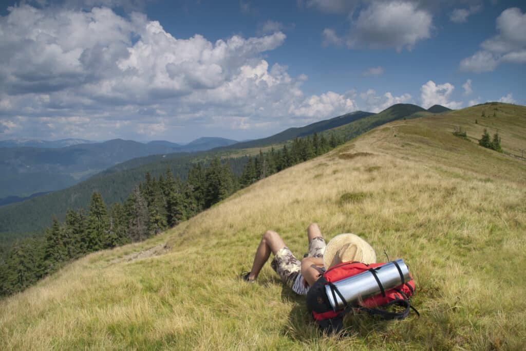 Hiker resting in the mountains 911388