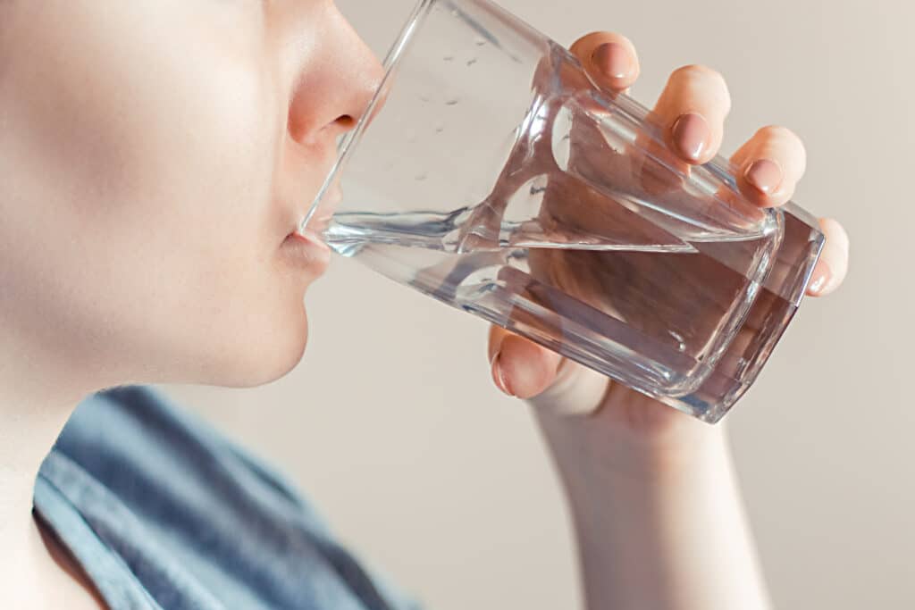 Woman drinks clean water world water day 2355319