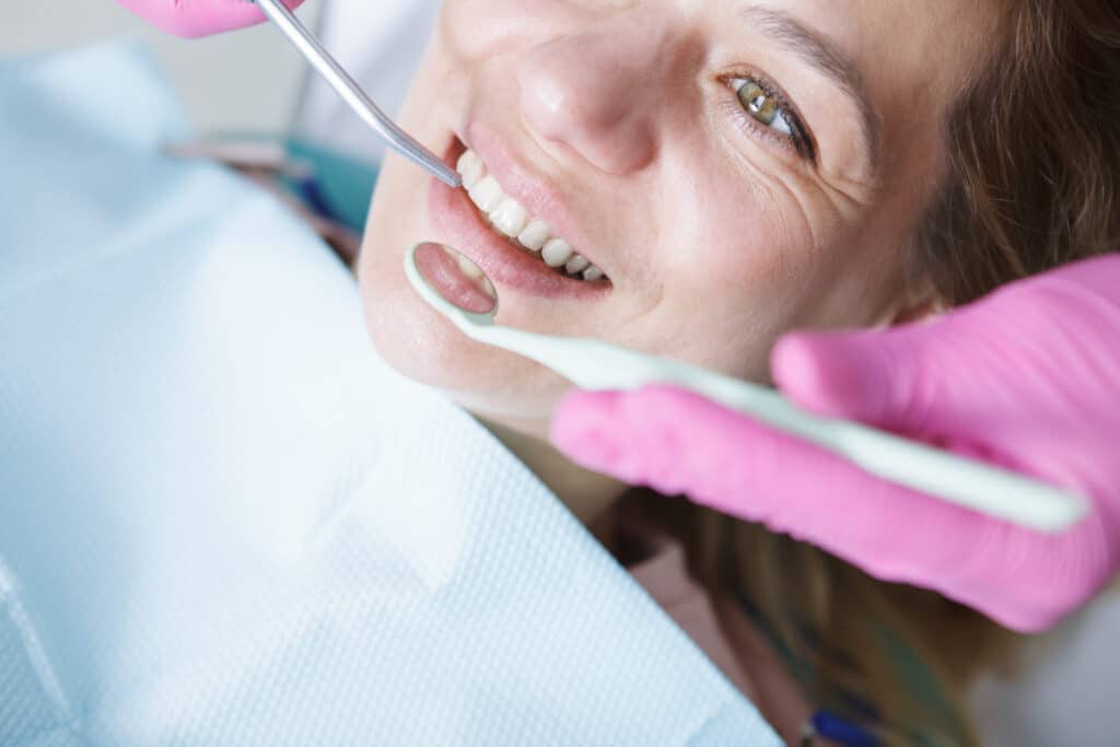 Woman getting teeth checkup 1068475
