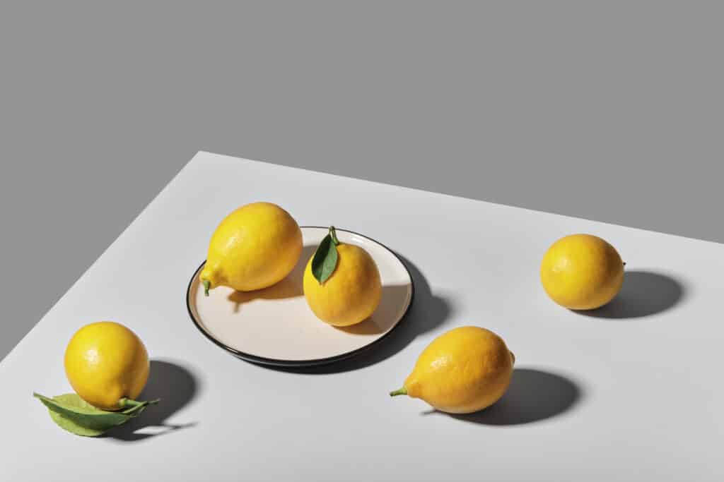 Yellow lemons on gray tablecloth 1295383 1