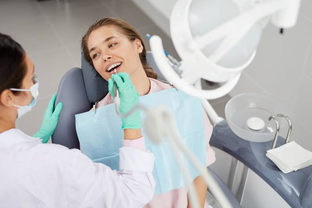 Young woman at dental exam 545472 2