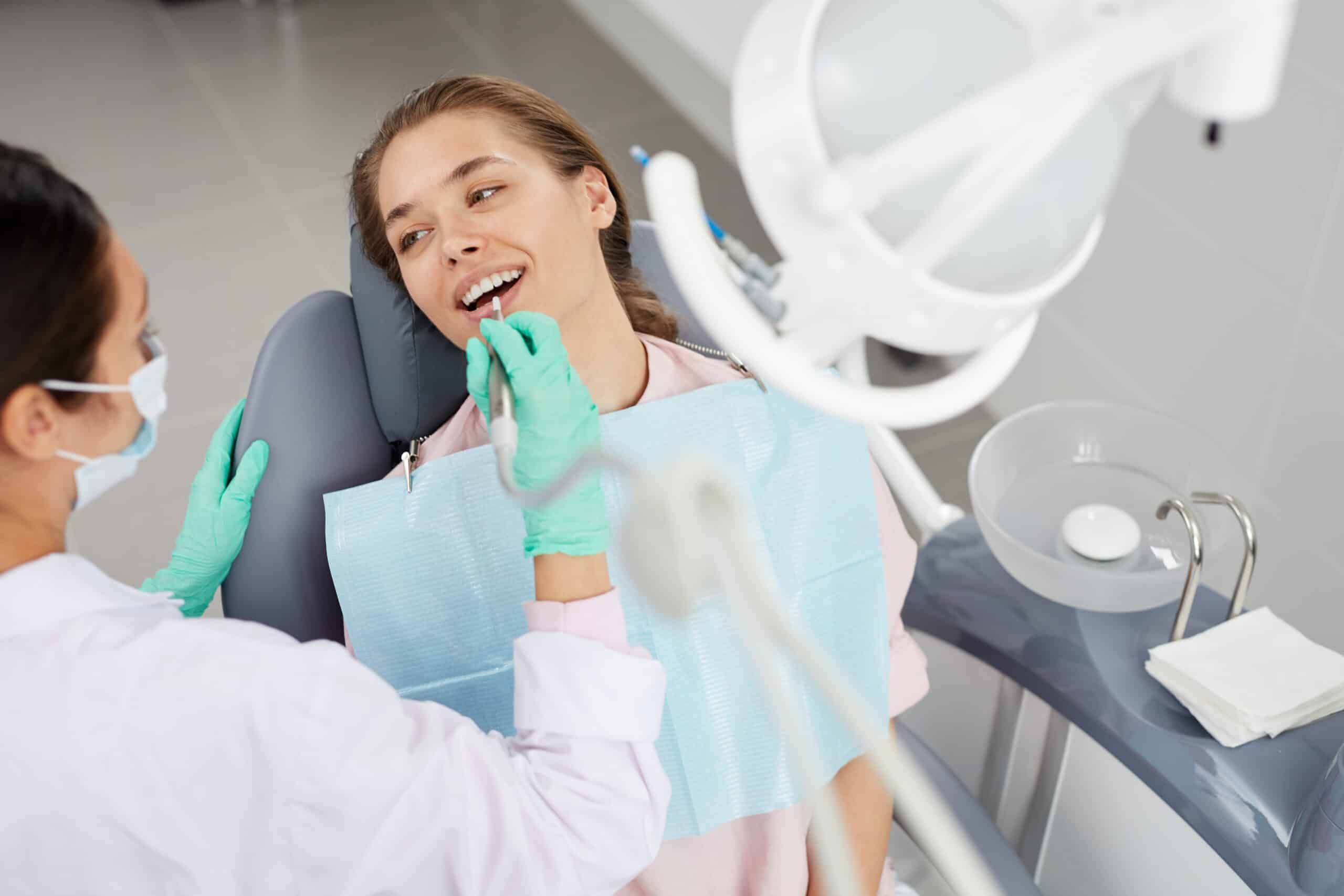 Young woman at dental exam 545472 3 scaled